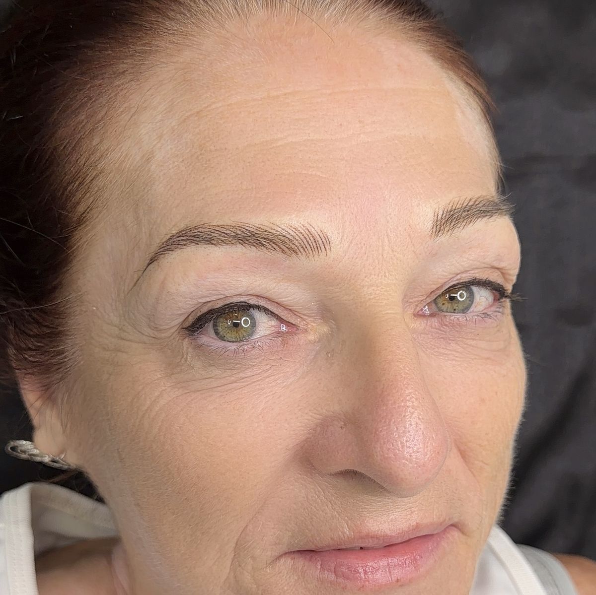 Mature client with refreshed, natural-looking brows