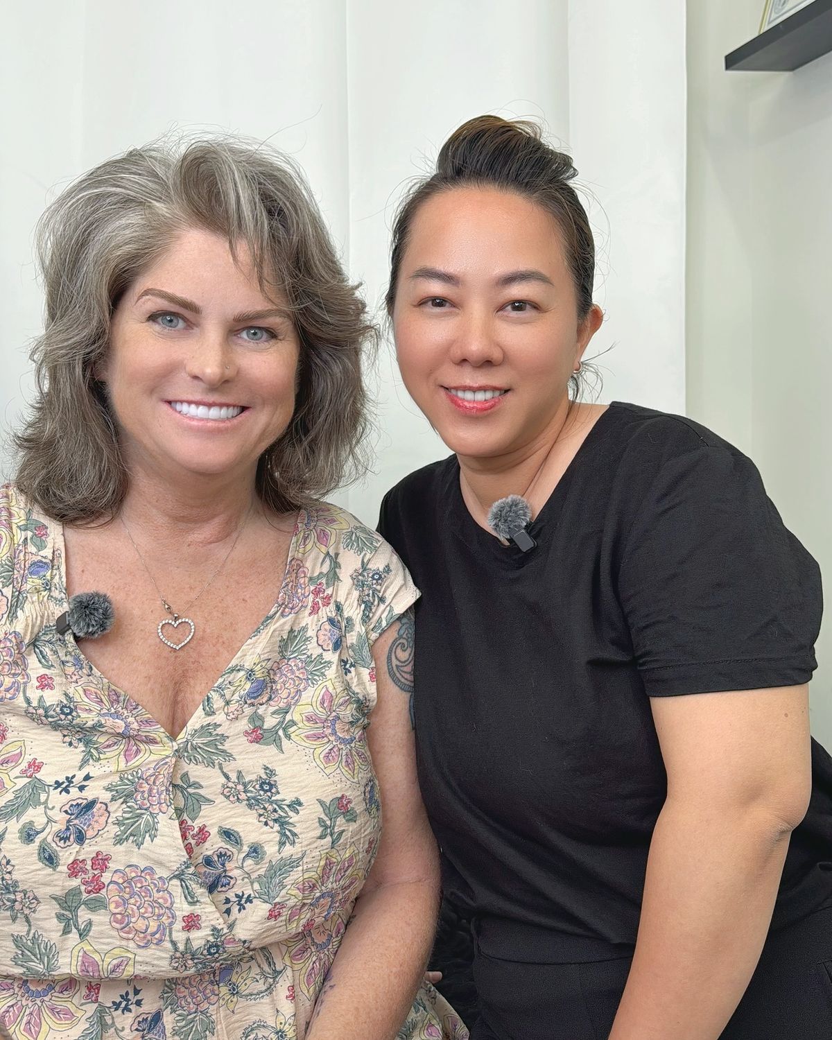 Happy client giving a thumbs up after her brow appointment