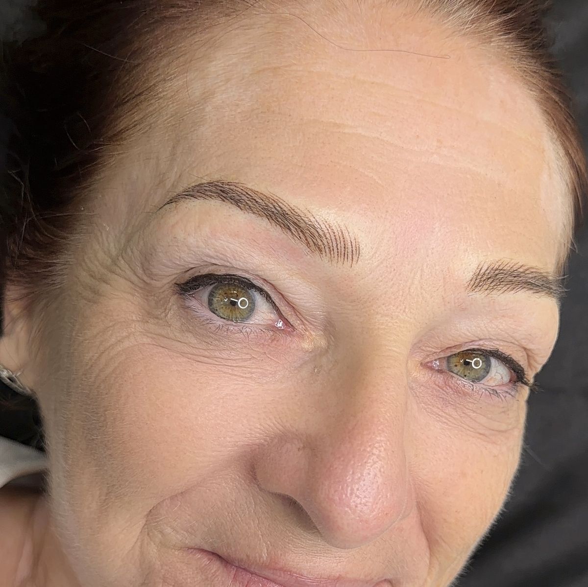 Client with soft, defined brows after her session