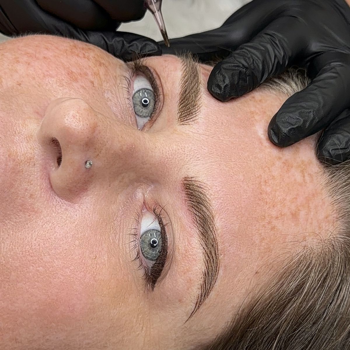 Close-up of freshly finished hair-stroke brows